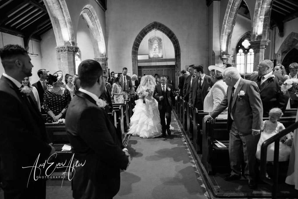 wedding photography at Goldsborough Hall, the bride has arrived at the church for er wedding 