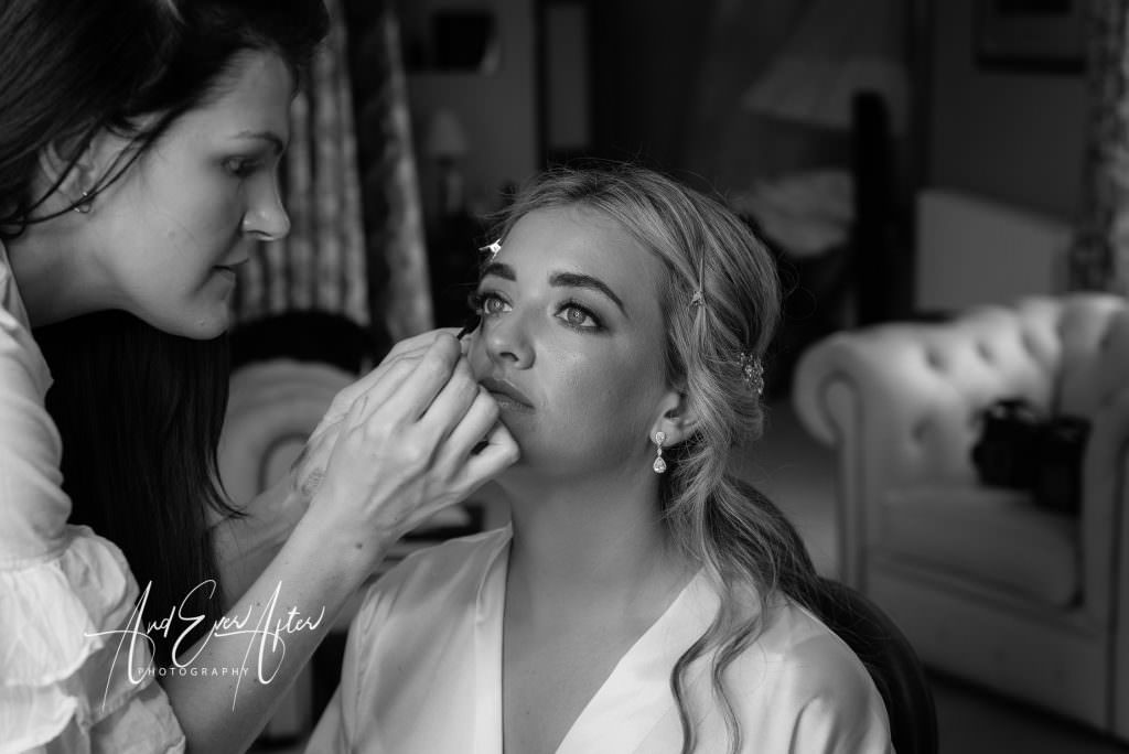 wedding day bridal preparations at Goldsborough Hall with the bride having her make up done