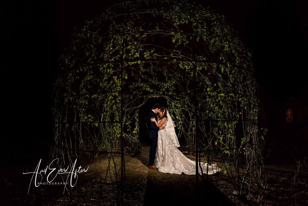 bride and groom in the gardens at he fig house middleton lodge